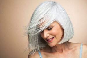 grey haired woman with side swept hair